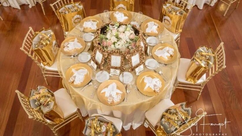 Image of a stunning gold decorated table ready for an event in the Grand Ballroom - Le Pavillon - Reception Venues in Lafayette La