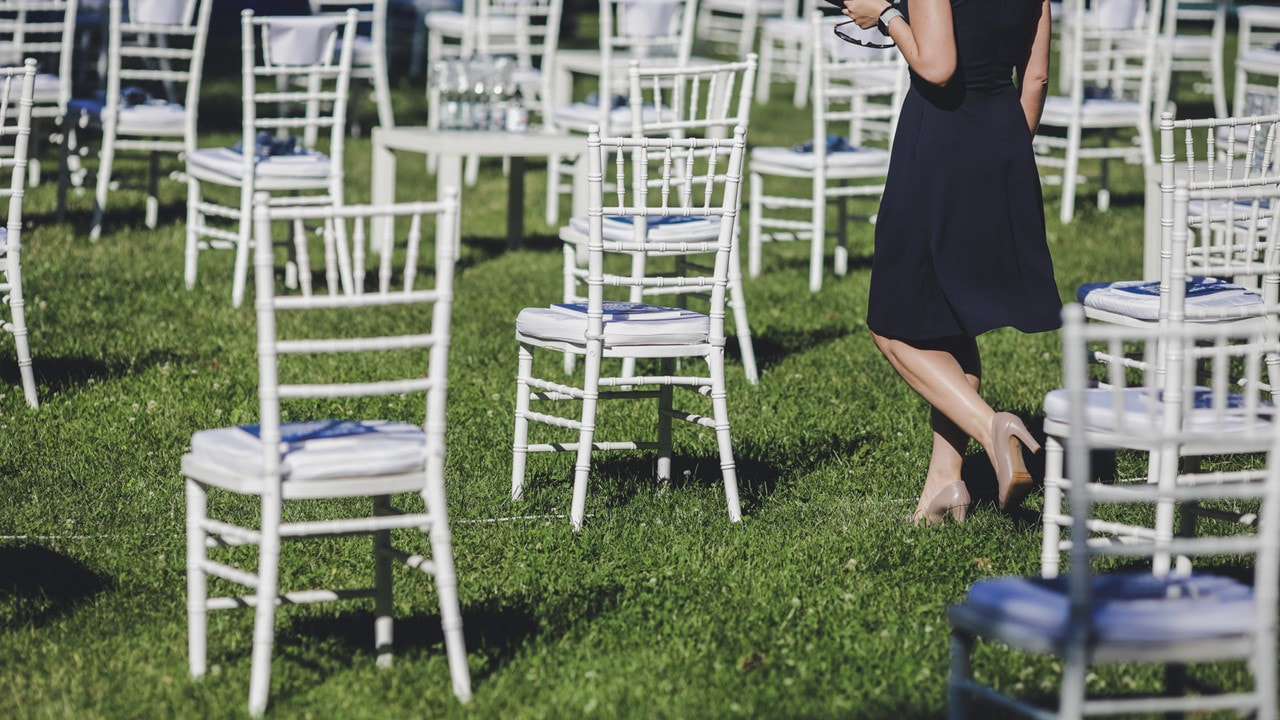 Outdoor private event with bamboo chairs spaced 6 feet apart - private event venues Lafayette La